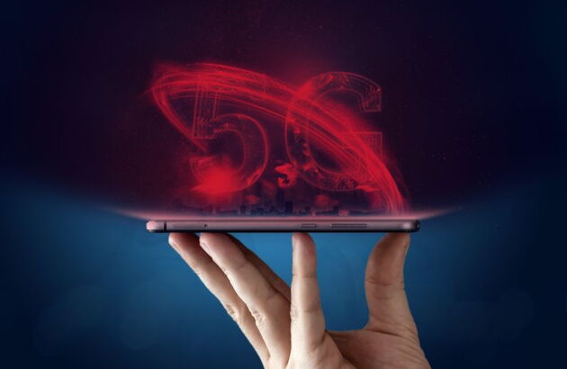 A hand holds an illustration with the 5G lettering.